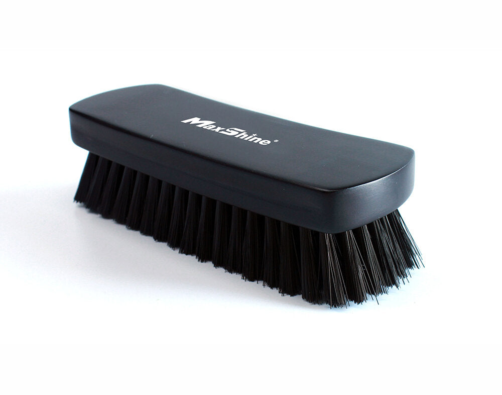 Official MaxShine 7012001 black textile and leather cleaning brush, side view.